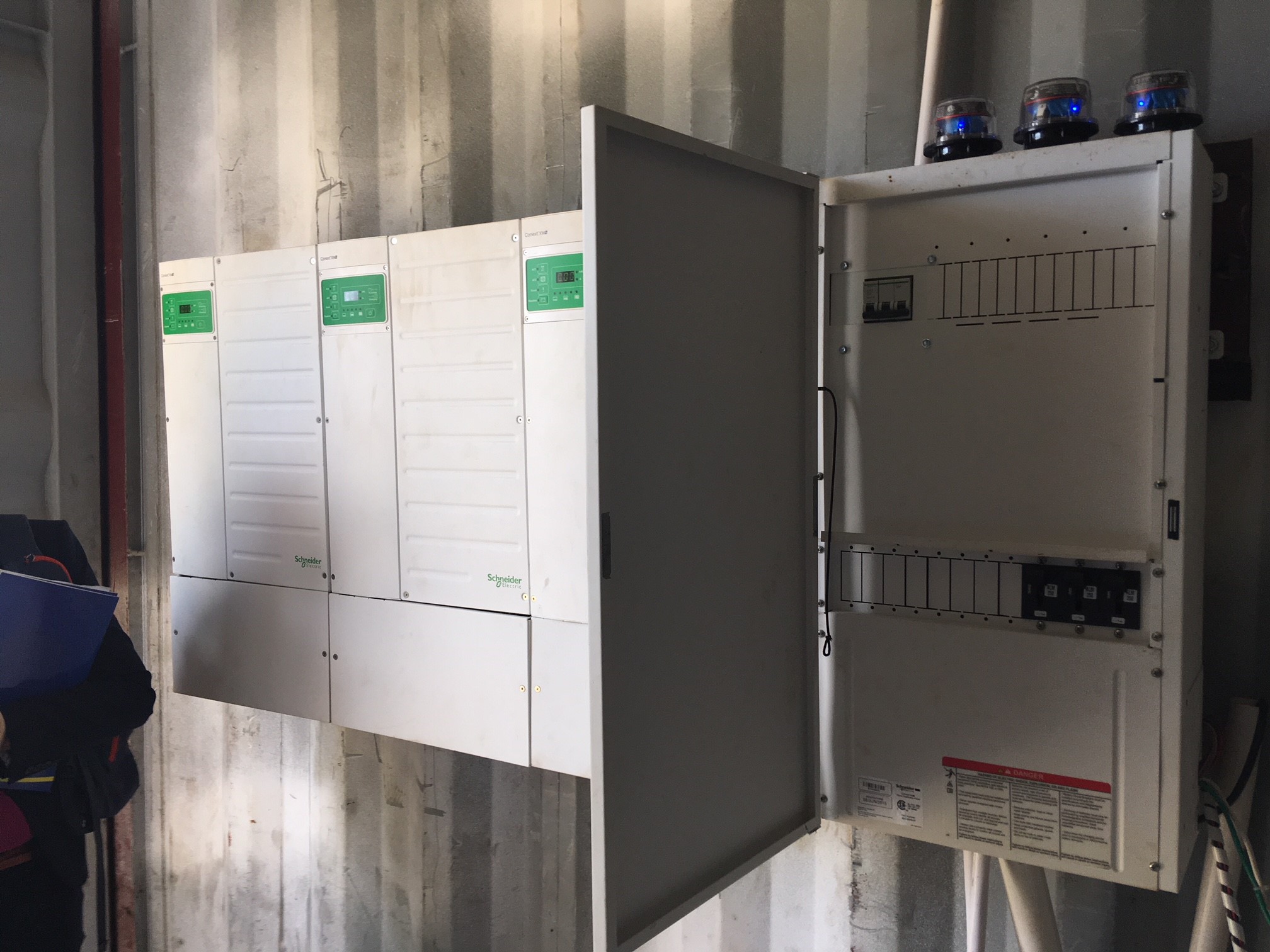 Stack of 3 6800W Schneider Electric Inverters producing 3 Phase power from the batteries.